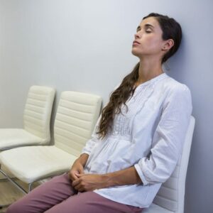woman waiting and tired in a waiting room